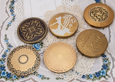 Lot 337 - Six circular gilt metal compacts c1950s