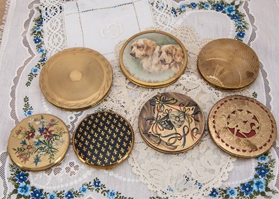 Lot 338 - Seven circular gilt metal compacts