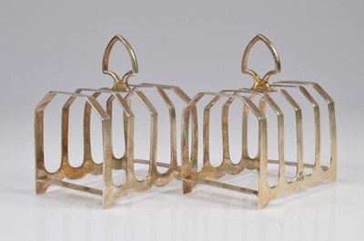 Lot 399 - A pair of George VI silver toast racks from Viners