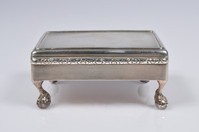 Lot 411 - A George V Britannia silver cigarette box from SWS & Co