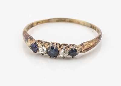 Lot 36 - A five stone diamond and sapphire dress ring
