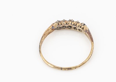 Lot 36 - A five stone diamond and sapphire dress ring