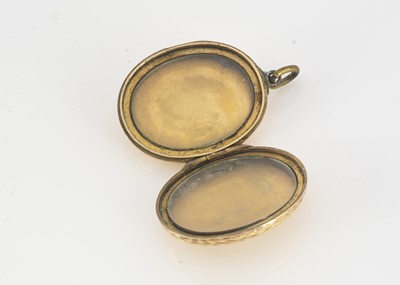 Lot 71 - An oval gold fronted locket