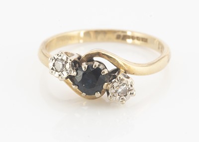 Lot 86 - A 9ct gold three stone sapphire and diamond cross over ring