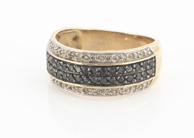 Lot 96 - A 9ct gold black and colourless diamond dress ring