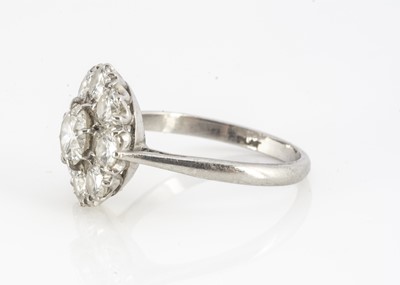 Lot 103 - A platinum and diamond cluster ring