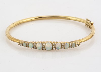 Lot 107 - A contemporary gold opal and diamond bangle