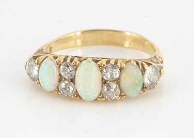 Lot 110 - An early 20th Century opal and diamond dress ring
