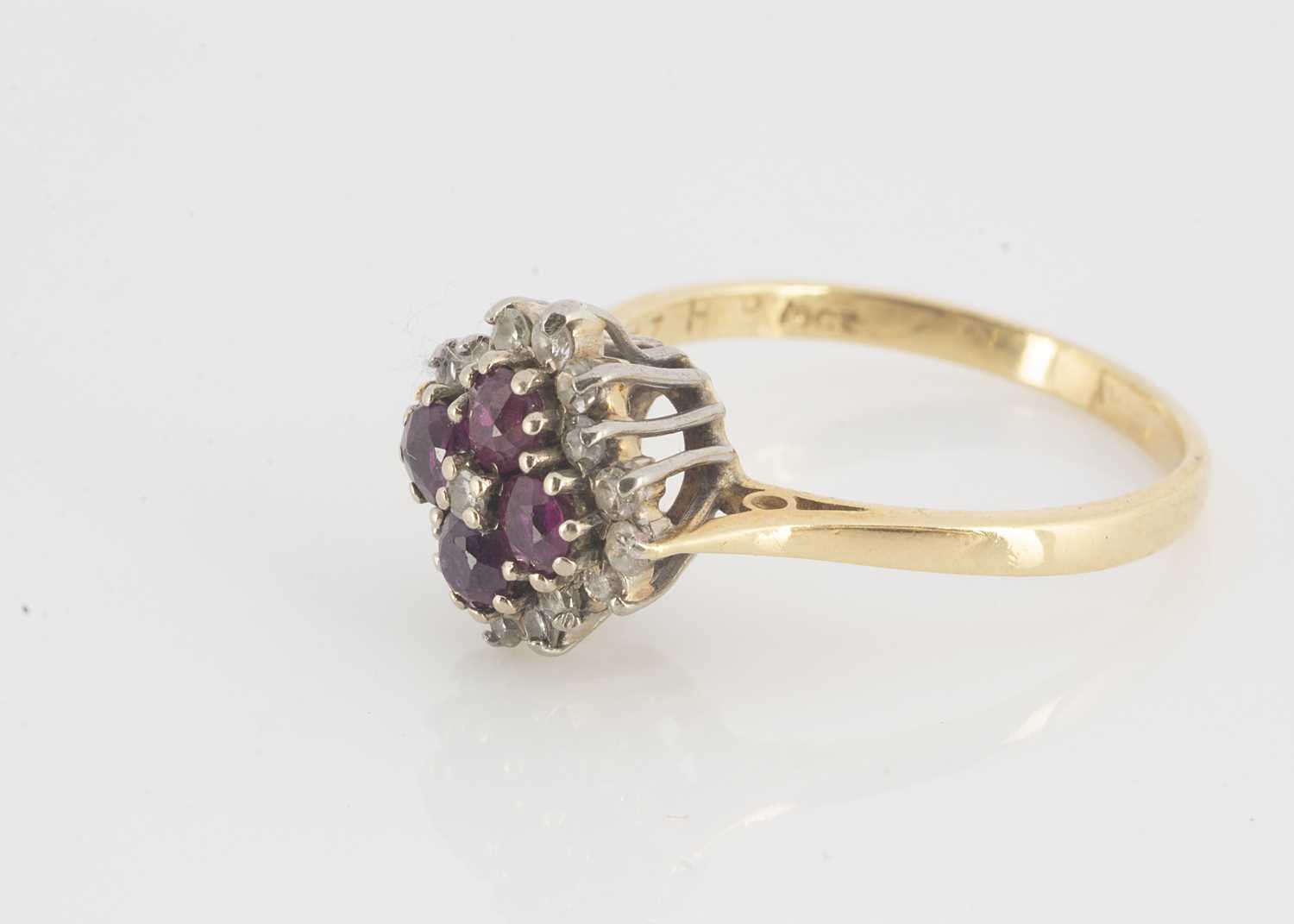 Lot 112 - A ruby and diamond cluster cruciform dress ring