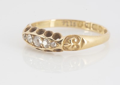 Lot 116 - An Edwardian five stone yellow 18ct gold dress ring