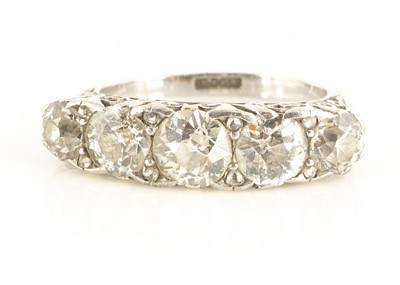 Lot 119 - A five stone 18ct and platinum old cut diamond dress ring