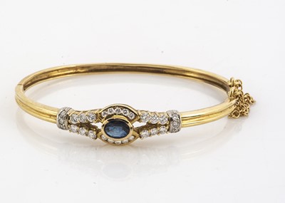 Lot 121 - A contemporary sapphire and diamond hinged oval bangle