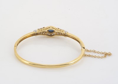 Lot 121 - A contemporary sapphire and diamond hinged oval bangle