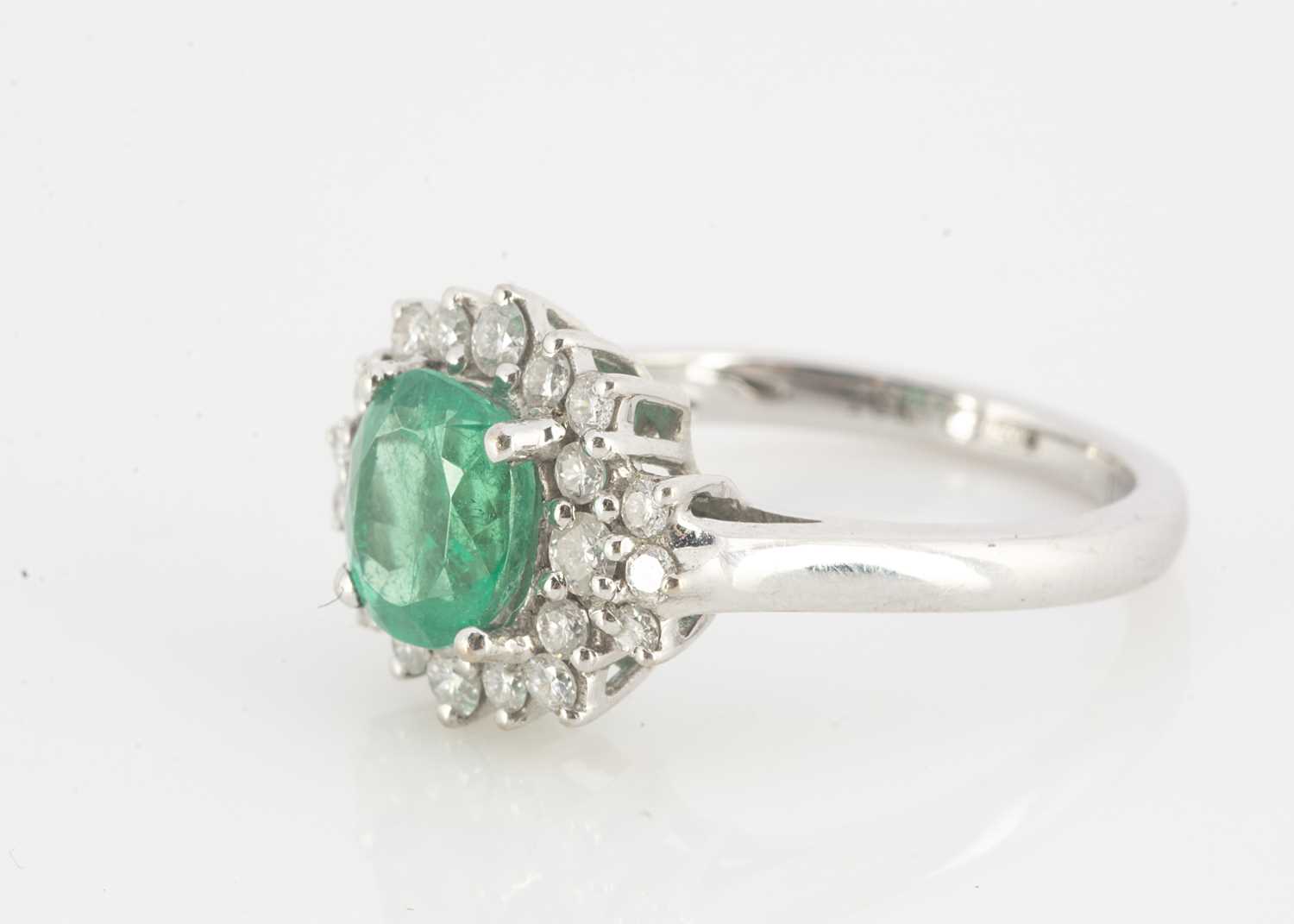 Lot 123 - An Iliana 18ct white gold emerald and diamond dress ring