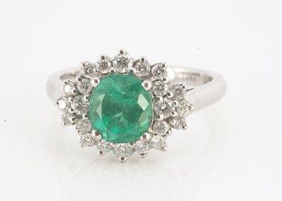 Lot 123 - An Iliana 18ct white gold emerald and diamond dress ring