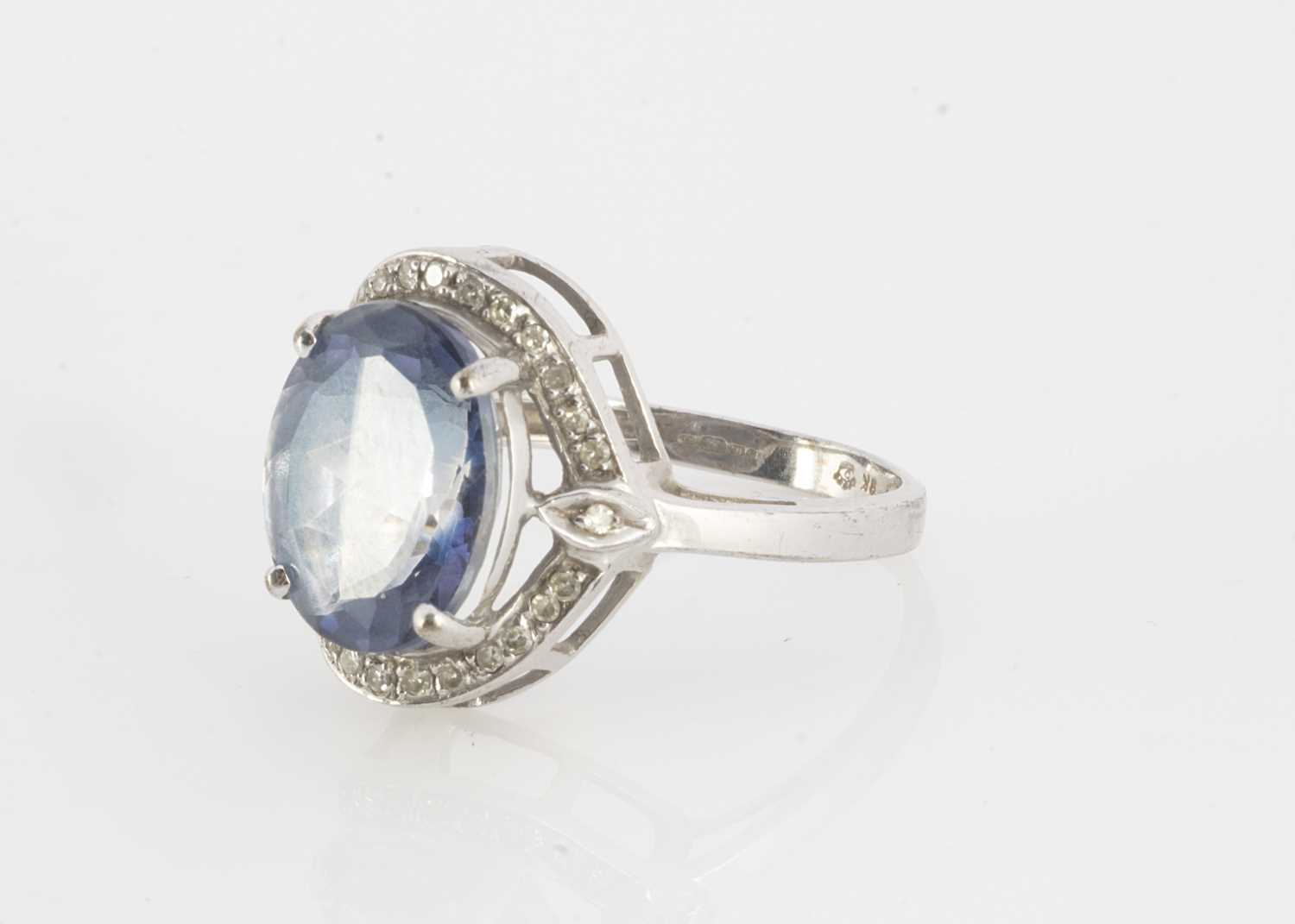 Lot 127 - A 9ct gold blue topaz and diamond dress ring