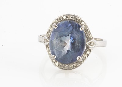 Lot 127 - A 9ct gold blue topaz and diamond dress ring