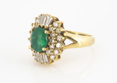Lot 130 - An 18ct gold emerald and diamond dress ring