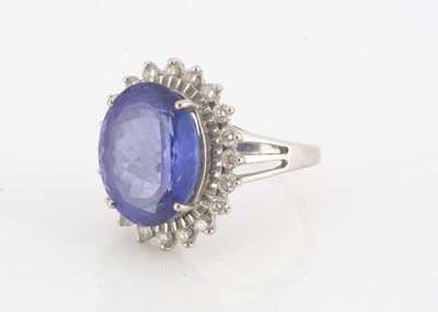 Lot 131 - An 18ct gold tanzanite and diamond cluster ring