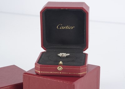 Lot 137 - A platinum Cartier cased and certificated diamond Art Deco style dress ring