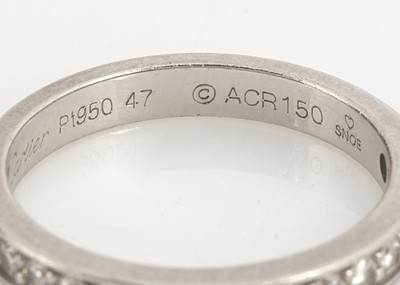 Lot 138 - A platinum and diamond Cartier cased and certificated half hoop eternity ring