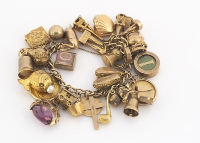 Lot 148 - A 9ct gold multi charm bracelet