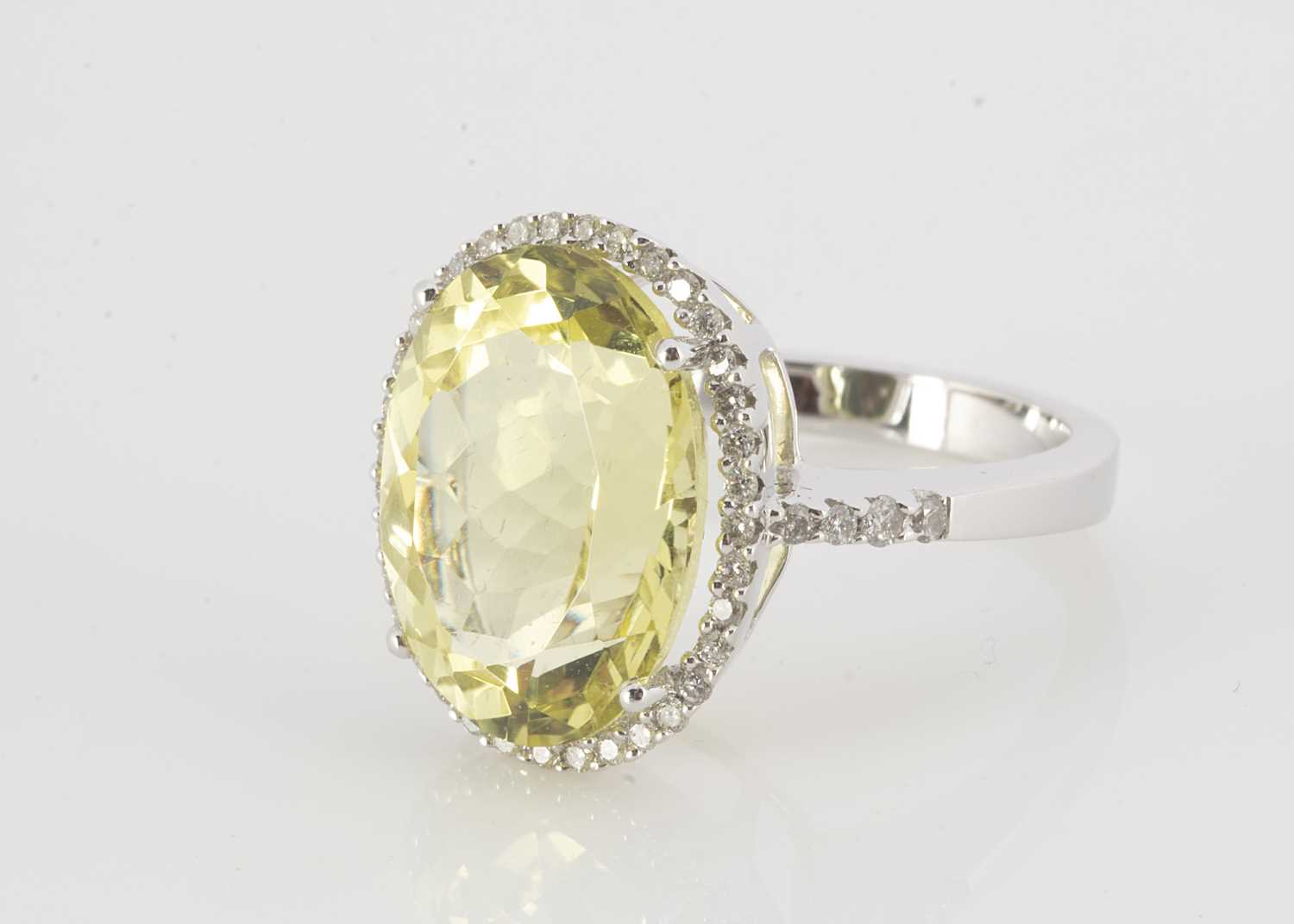 Lot 161 - A contemporary white 18ct gold lemon citrine and diamond dress ring
