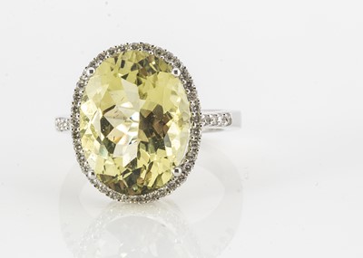 Lot 161 - A contemporary white 18ct gold lemon citrine and diamond dress ring