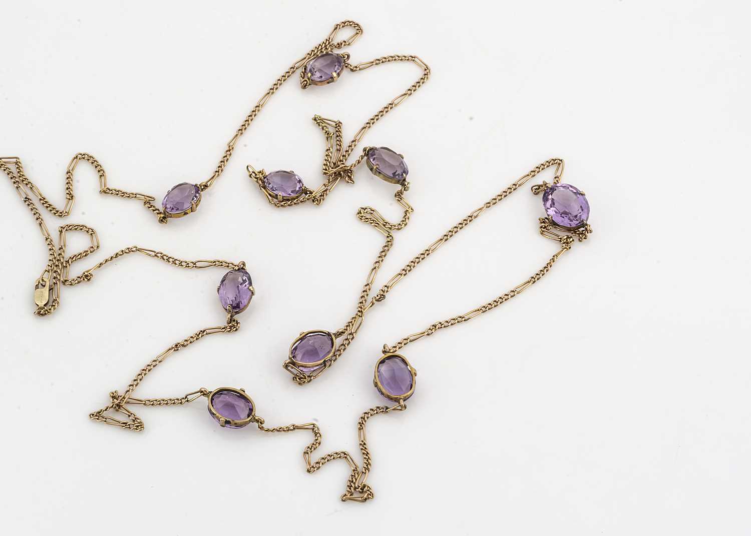 Lot 171 - An opera length 9ct gold curb link and amethyst necklace