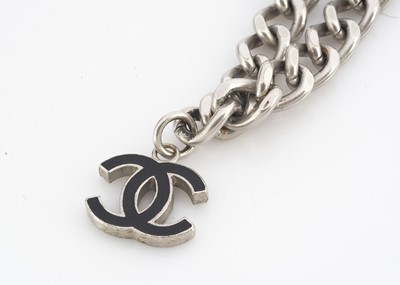 Lot 176 - A certificated Chanel white metal charm bracelet