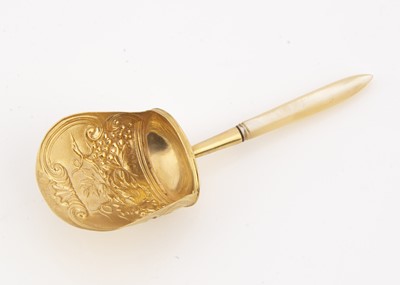 Lot 217 - A Georgian period silver gilt and mother of pearl handled tea caddy spoon by Samuel Pemberton