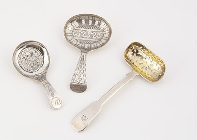 Lot 229 - Three Georgian period silver pierced tea caddy spoons