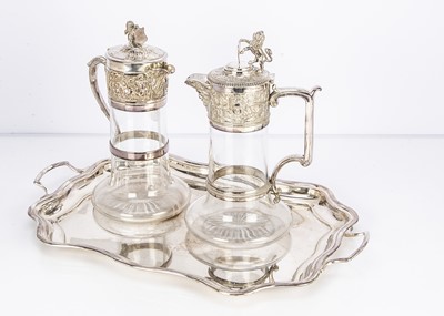 Lot 282 - Two Edwardian and later silver plated and glass claret jugs
