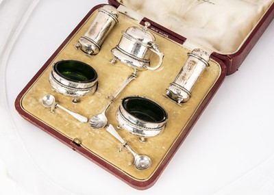 Lot 288 - A cased George V silver five piece cruet set