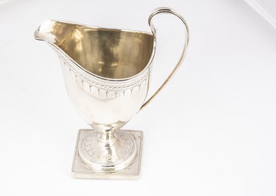 Lot 290 - A George III silver helmet shaped milk jug by CH