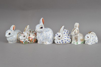 Lot 352 - Six Royal Crown Derby bone china rabbit paperweights