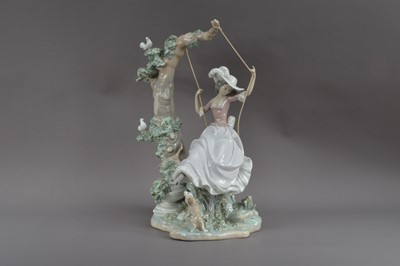 Lot 381 - A large Lladro porcelain figurine of a lady on a swing