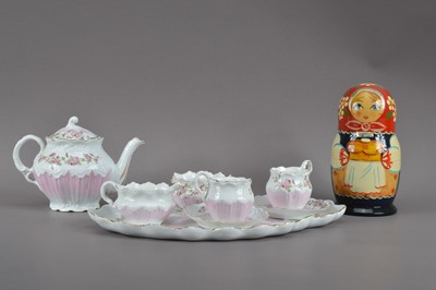 Lot 383 - A 20th century continental porcelain tea set for two