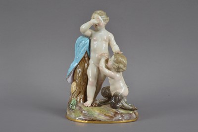Lot 386 - A 19th century Meissen porcelain figurine of a cherub and young satyr