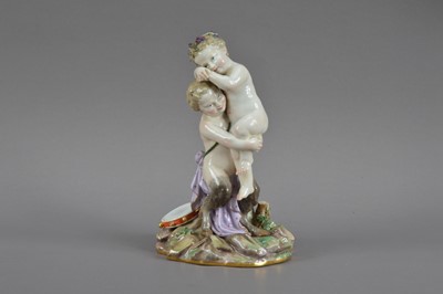 Lot 388 - A 19th century Meissen seconds quality porcelain figurine of a cherub and satyr