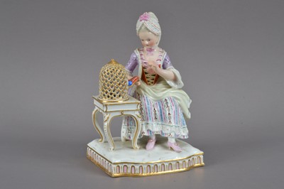 Lot 390 - A restored 19th century Meissen porcelain figurine of a lady and bird