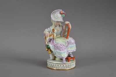 Lot 447 - A Meissen porcelain figurine of a lady and a dog