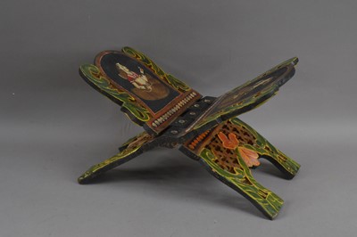 Lot 456 - An ebonised and hand-painted wooden Koran stand