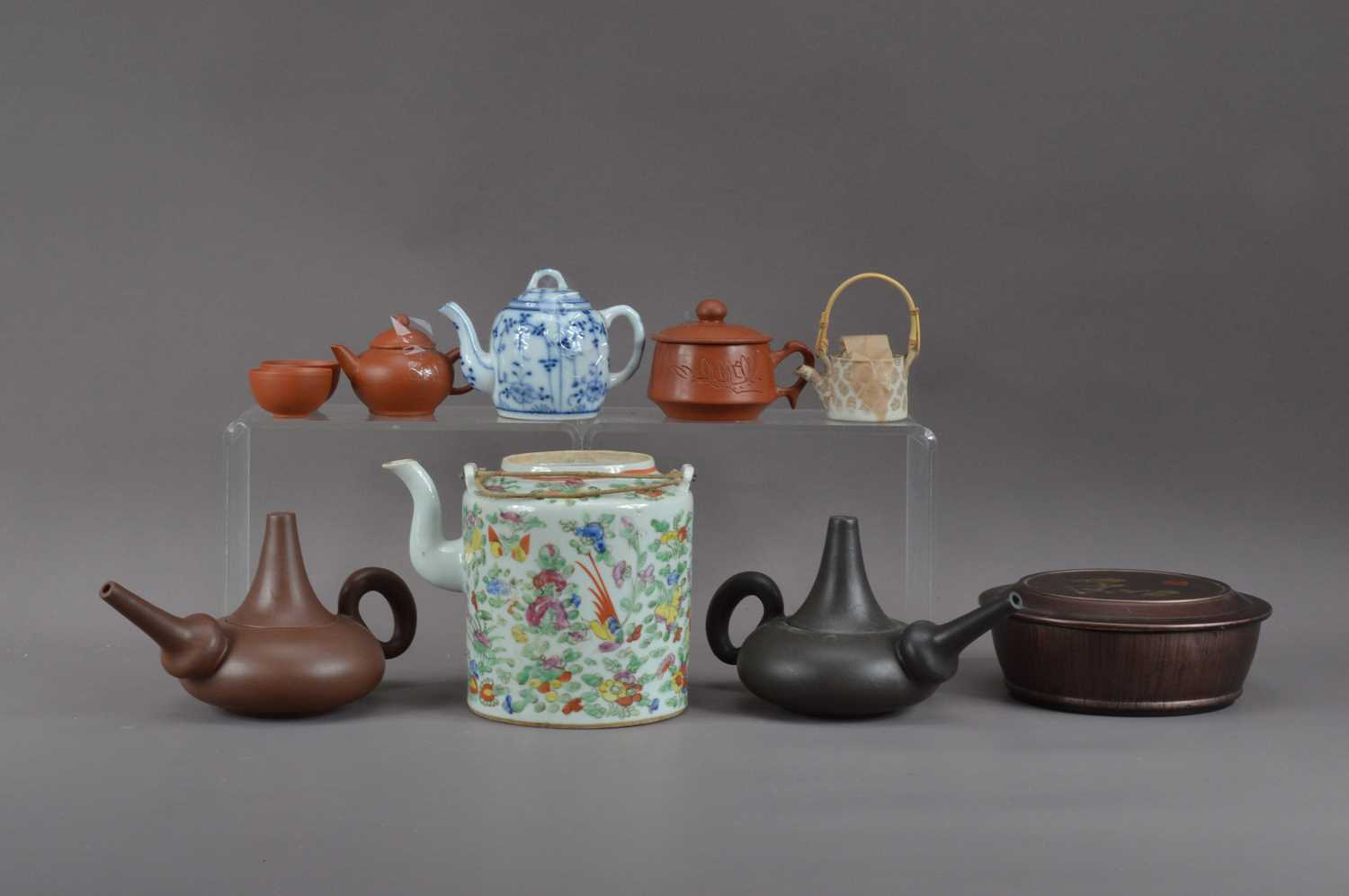 Lot 487 A collection of Chinese teapots,